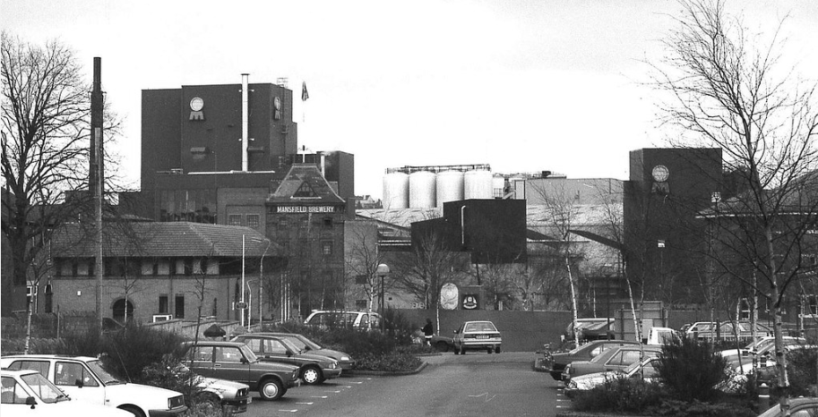 The Mansfield Brewery Site in black and white, showing the previous brewery building surrounded by cars in an old carpark, years before work was completed here by BSH.