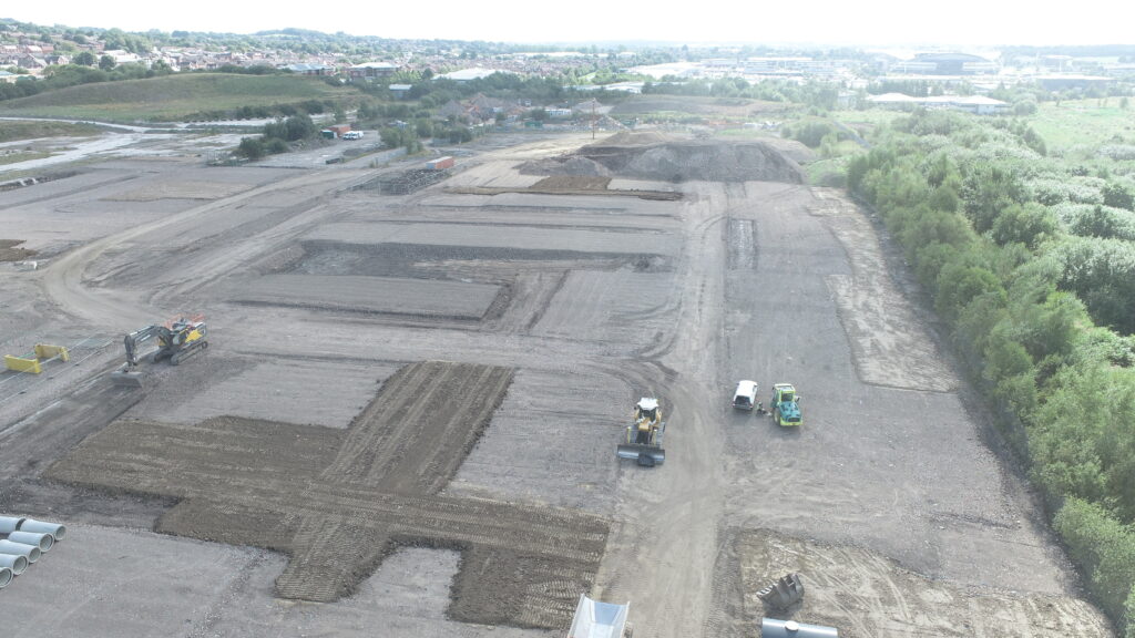 An aerial shot showing numerous excavators dotted around a completed site, after remediation works by the team at BSH.