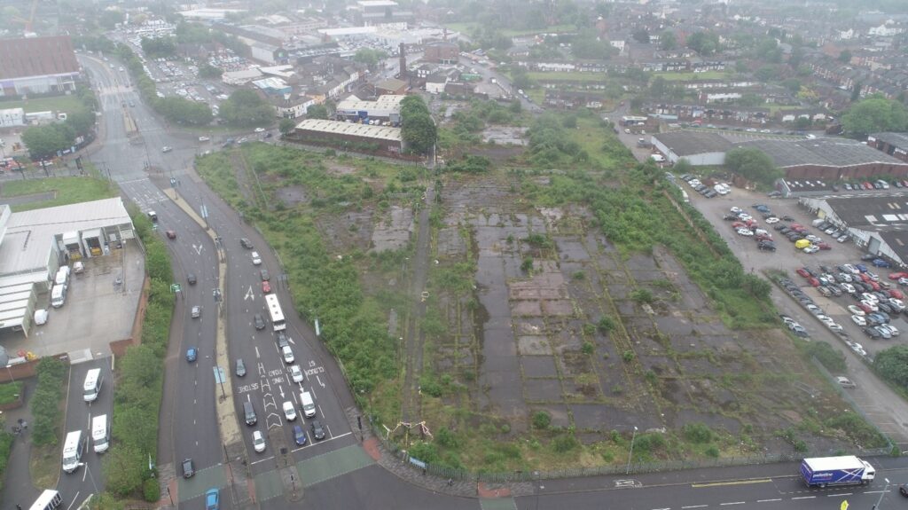 Aerial view of the Synter BMW brownfield site before redevelopment and earthworks construction.